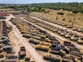 Old rusty broken Russian military vehicles in industrial area, aerial view