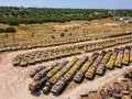 Old rusty broken Russian military vehicles in industrial area, aerial view