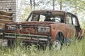 Old rusty Soviet retro car in an abandoned city Royalty Free Stock Photo