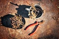 Old rusty broken tools, nails and pliers on a background of rust Royalty Free Stock Photo