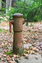 Old rusty and broken water tap in the park Royalty Free Stock Photo