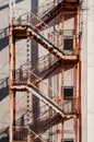 Old rusty building Emergency Fire Escape with metal iron stairway Royalty Free Stock Photo