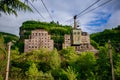 Old rusty cable car and overgrown abandoned factory in Chiatura, Georgia