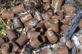 Old rusty cans lie on the ground and dry grass in nature Royalty Free Stock Photo