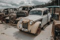 Old rusty car in the abandoned car graveyard.