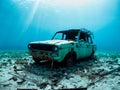 old rusty car with a broken wreck on the beach Royalty Free Stock Photo