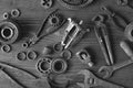 Old rusty car parts and old repair tools on a wooden table. Royalty Free Stock Photo