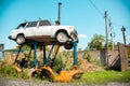 Rostov-on-Don, Russia. 08.08.2020. Old rusty car VAZ-2104 Kalinka, Signet stands on metal supports in a landfill