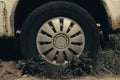 Old rusty car wheel. Cracked tires and rusted hubcaps Royalty Free Stock Photo