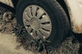 Old rusty car wheel. Cracked tires and rusted hubcaps Royalty Free Stock Photo