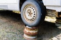 Old rusty car wheel. Cracked tires and rusted hubcaps Royalty Free Stock Photo