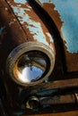 Old, rusty car wreck front and lamp detail Royalty Free Stock Photo