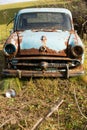 Old, rusty car wreck front and lamp, outdoor Royalty Free Stock Photo