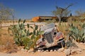 Old and rusty car wreck at the last gas station before the Namib desert. Solitaire, Namibia