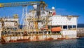 Old rusty cargo tansportration docks with crane in the sea port Royalty Free Stock Photo