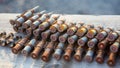 Old rusty cartridges in a machine-gun belt. war in Ukraine. military ammunition Royalty Free Stock Photo