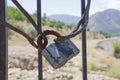 Old rusty castle. the gate is locked. metal harnesses