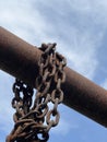 old rusty chain on a blue sky Royalty Free Stock Photo