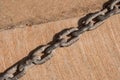 Old rusty chain detail on floor Royalty Free Stock Photo