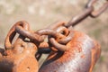 Old rusty chain on the field on the ground background Royalty Free Stock Photo