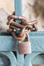 An old rusty chain lock closes the gate. Royalty Free Stock Photo