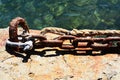 Old chain, rocks in trasparent water, stones, water, abstract background Royalty Free Stock Photo