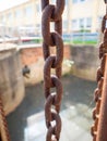 Old rusty chained and wheels. Cogs control the floodgates Royalty Free Stock Photo