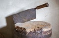 Old rusty chopping knife in a wooden cutting block Royalty Free Stock Photo