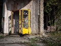 Old rusty classic soviet yellow telephone booth aka telephone kiosk, telephone call box, telephone box or public call box in Pr Royalty Free Stock Photo