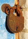 Old rusty closed padlock