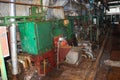 Old rusty closed peeling shop at a abandoned industrial obsolete chemical petrochemical engineering refinery with metal iron pipes