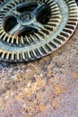 Old rusty cog wheel on rusty metal surface Royalty Free Stock Photo