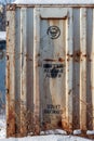 Old rusty container with the emblem and the inscription \