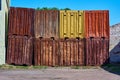 Old rusty containers, front view at the dump Royalty Free Stock Photo