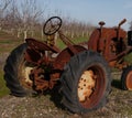 Old rusty crank start tractor