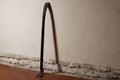 the old rusty crowbar against a plastered wall Royalty Free Stock Photo