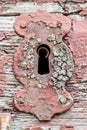 Old, rusty, decay, cracked, vintage, red steel lock, keyhole Royalty Free Stock Photo