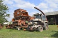 Old rusty disassembled combine harvester.