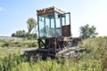 Old rusty disassembled combine harvester.