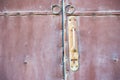 Close up old red door and rusty door handle Royalty Free Stock Photo