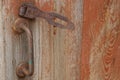 Old Rusty Door Handle And An Iron Latch In The Rust On The Wooden Doors