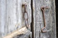 old rusty door latch on a wooden door. Close-up. Problematic weathered panels. Old wall texture background. Detail of an Royalty Free Stock Photo