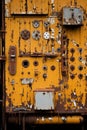 an old rusty door with many different types of buttons and knobs on it Royalty Free Stock Photo