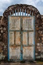 Old rusty door with pad locks and rock arch at historical palace of the Fon, Bafut, Cameroon, Africa Royalty Free Stock Photo