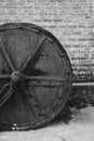 Old and rusty drum roller outside an old weaving factory