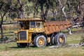 An old rusty earthmoving truck in a green field in regional Australia Royalty Free Stock Photo