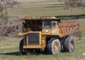 An old rusty earthmoving truck in a green field in regional Australia Royalty Free Stock Photo