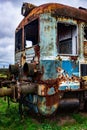 Old rusty electric train abandoned on unused siding