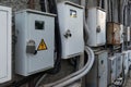 Old rusty electricity meter boxes with padlocks