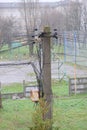 Old rusty electricity switchboard with wires connected to a pole. Royalty Free Stock Photo